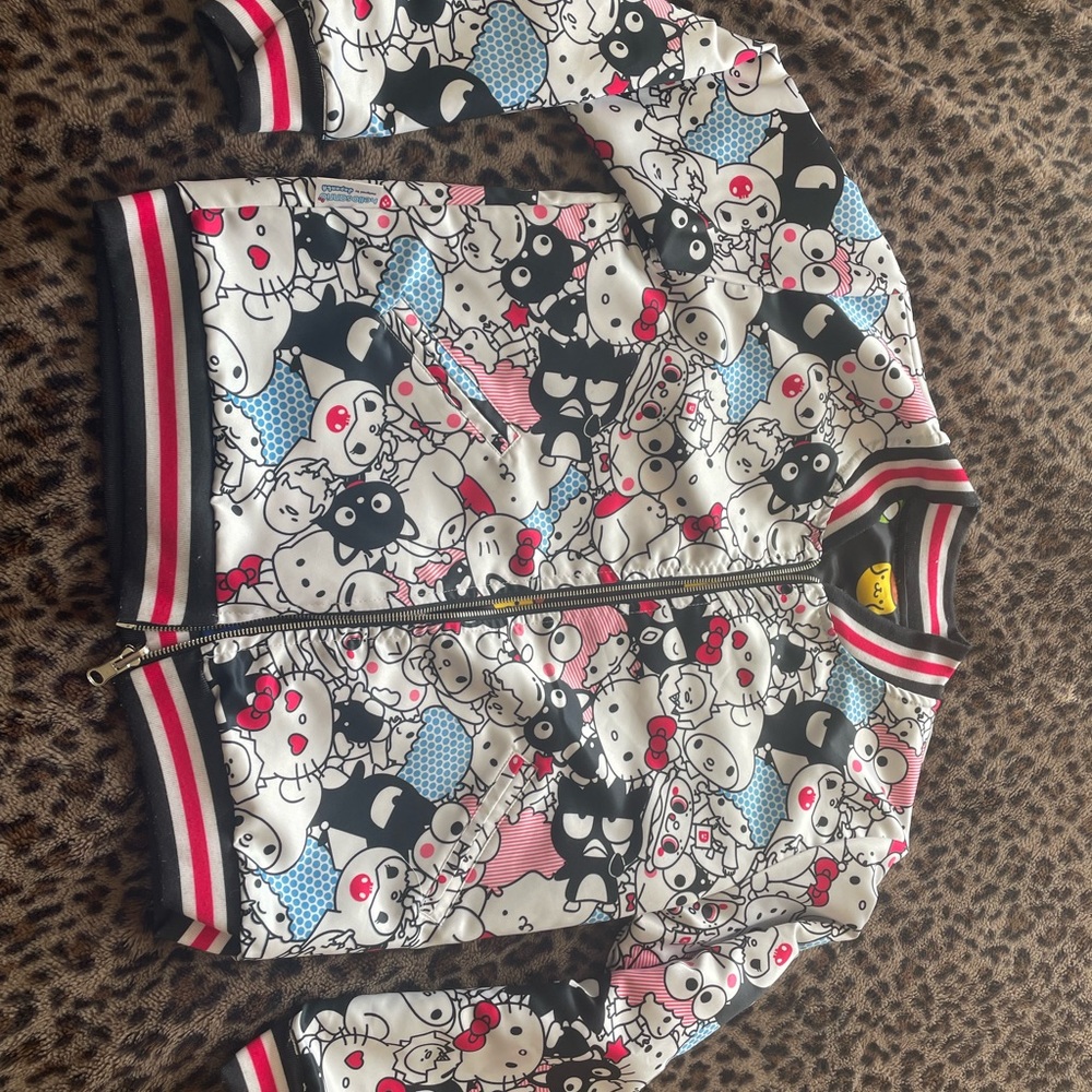 Hello Sanrio reversible satin bomber jacket 
So many sanrio characters!!